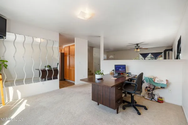 a workspace with furniture and a window