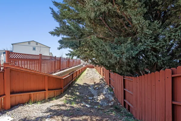 a view of a roof with wooden fence