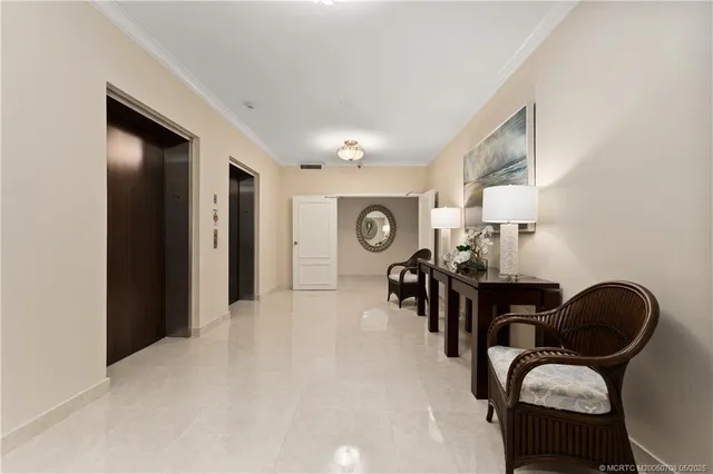a view of a balcony with chairs and wooden floor