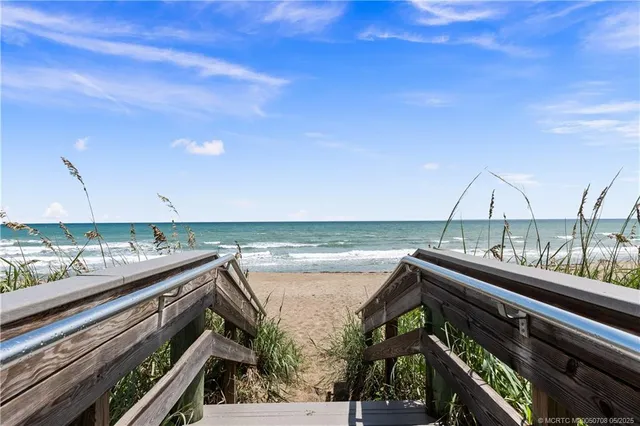 a view of a balcony with an ocean view