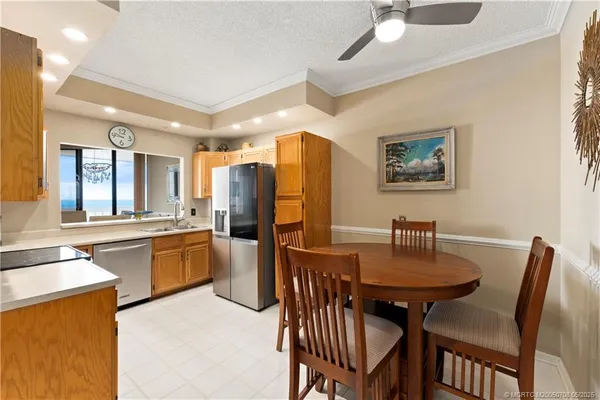a open kitchen with stainless steel appliances granite countertop a sink and cabinets