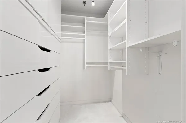 a bathroom with a sink a toilet and a large mirror