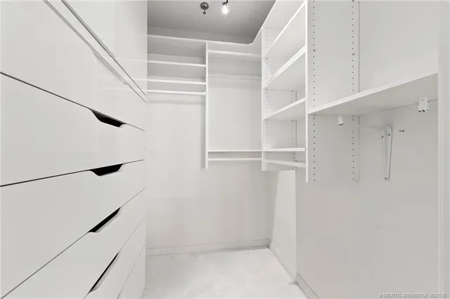 a bathroom with a sink a toilet and a large mirror