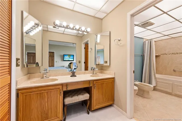 a bathroom with a toilet a sink and bathtub