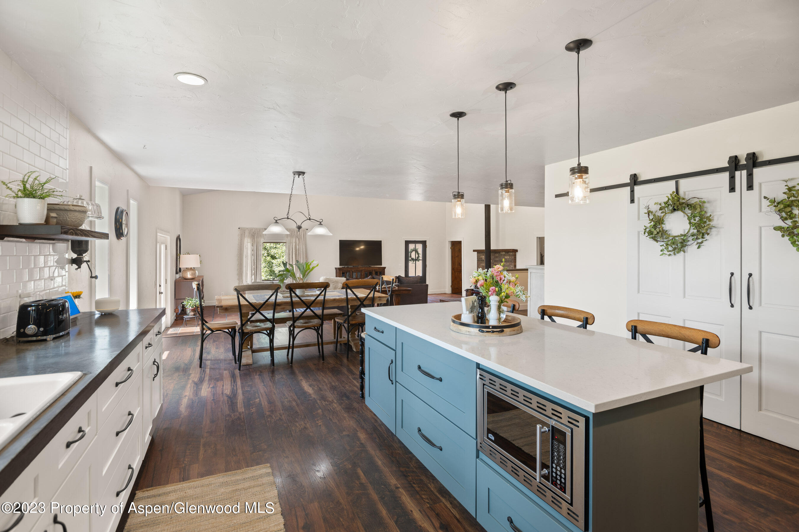 1055 County Road 225 Rifle, CO 81650 - Photo 1 of 49 a view of kitchen island wooden floor and living room