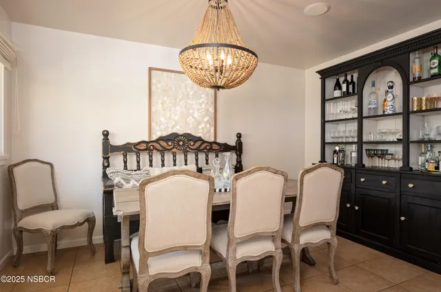 a view of a dining room with furniture and window