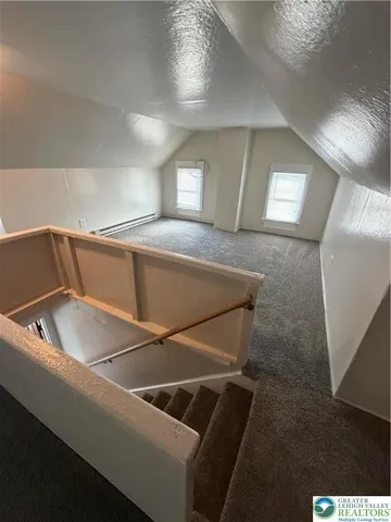 a view of a room with a fireplace