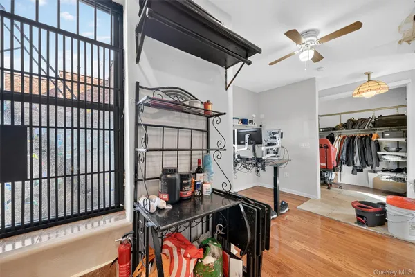 a view of a livingroom with furniture gym equipment
