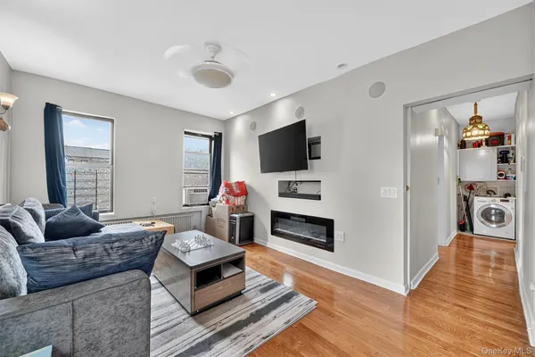 a living room with furniture and a flat screen tv