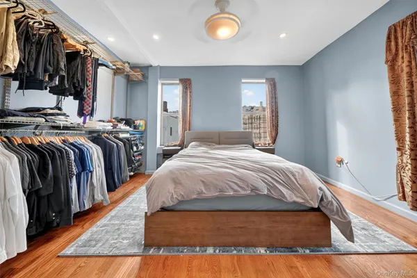 a bed sitting in a bedroom next to a window