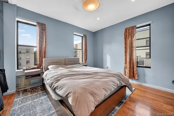 a bedroom with a bed and window