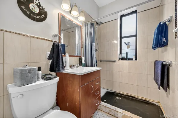 a bathroom with a sink a mirror and a toilet