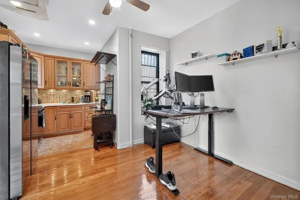 a view of a workspace with furniture and a kitchen