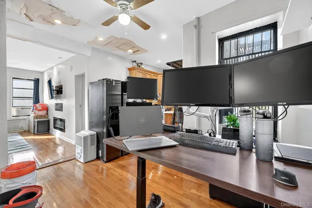 a kitchen with stainless steel appliances a microwave a stove and refrigerator