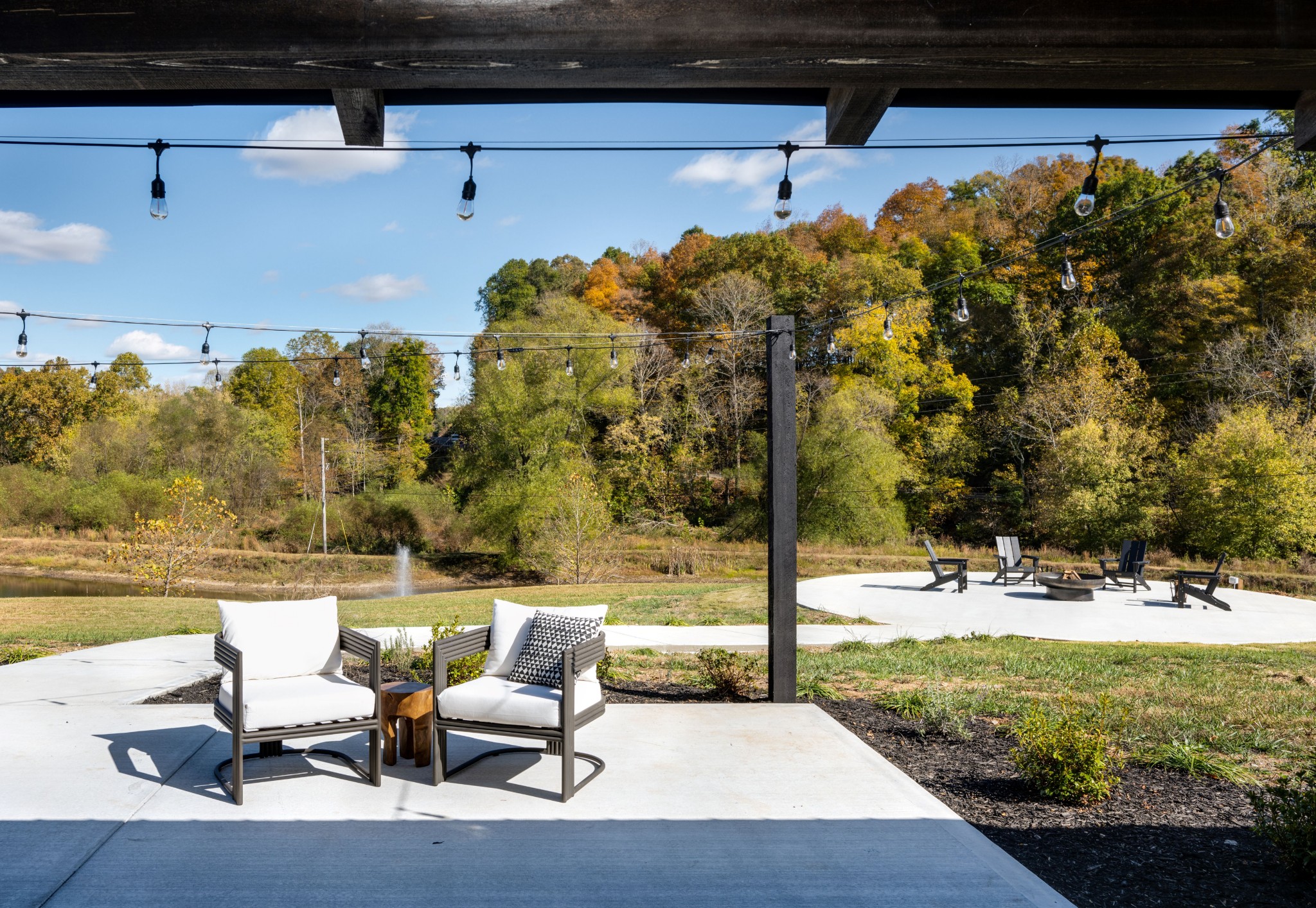 232 Waterloo Road Lawrenceburg, TN 38464 - Photo 20 of 46 a view of a swimming pool with lawn chairs and couches
