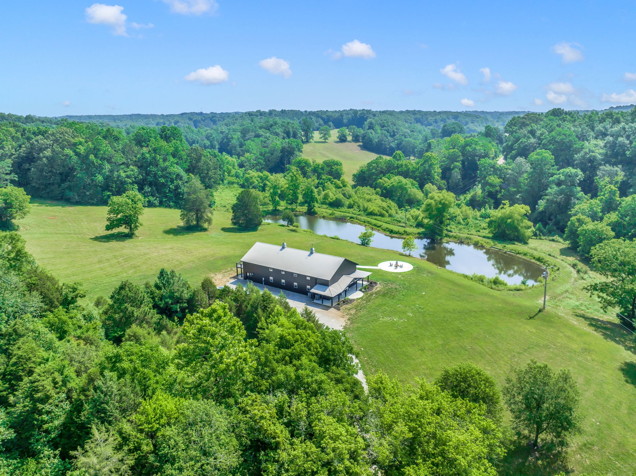 232 Waterloo Road Lawrenceburg, TN 38464 - Photo 2 of 46 a view of a big yard with potted plants and large tree