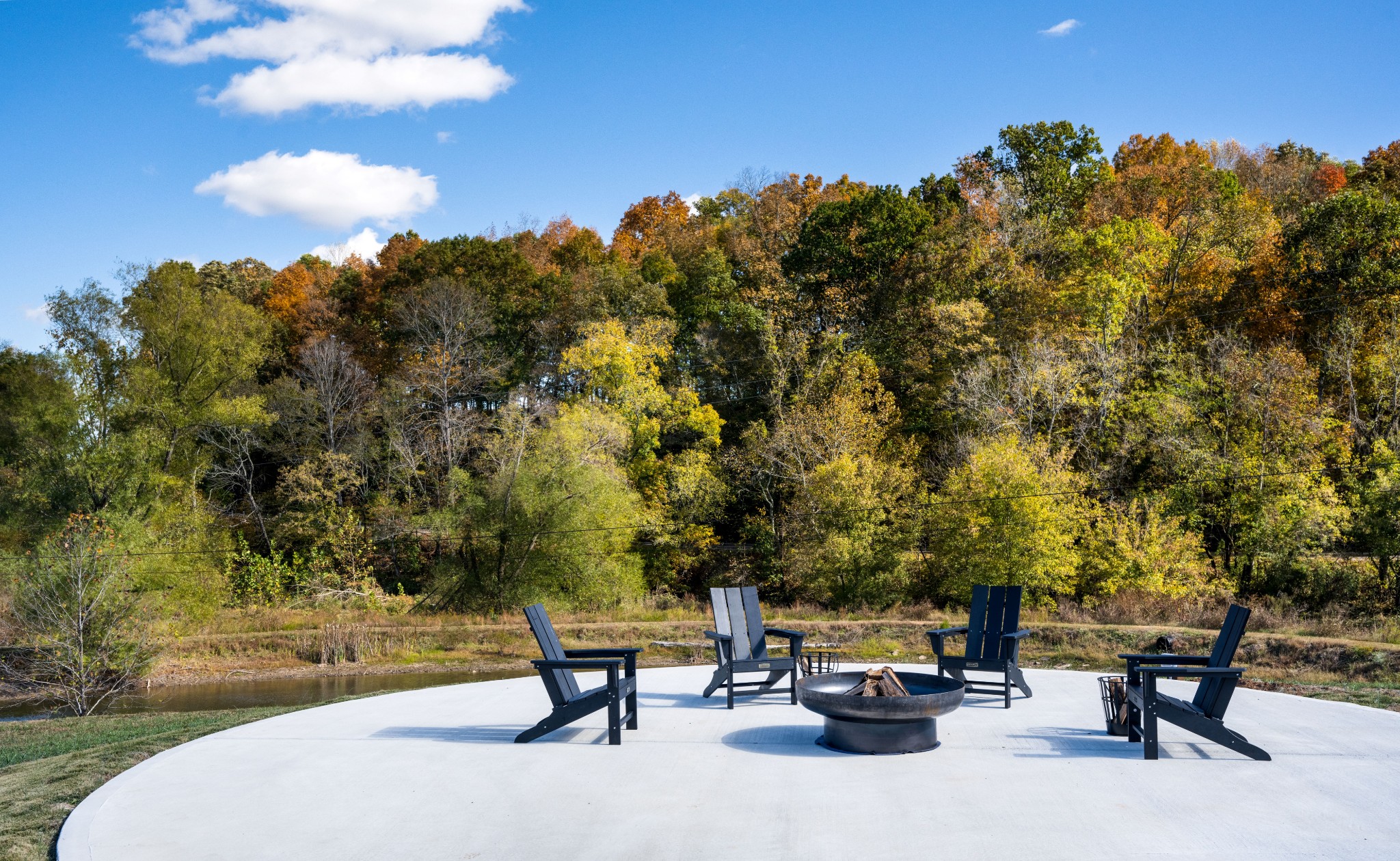 232 Waterloo Road Lawrenceburg, TN 38464 - Photo 22 of 46 a swimming pool with outdoor seating and trees