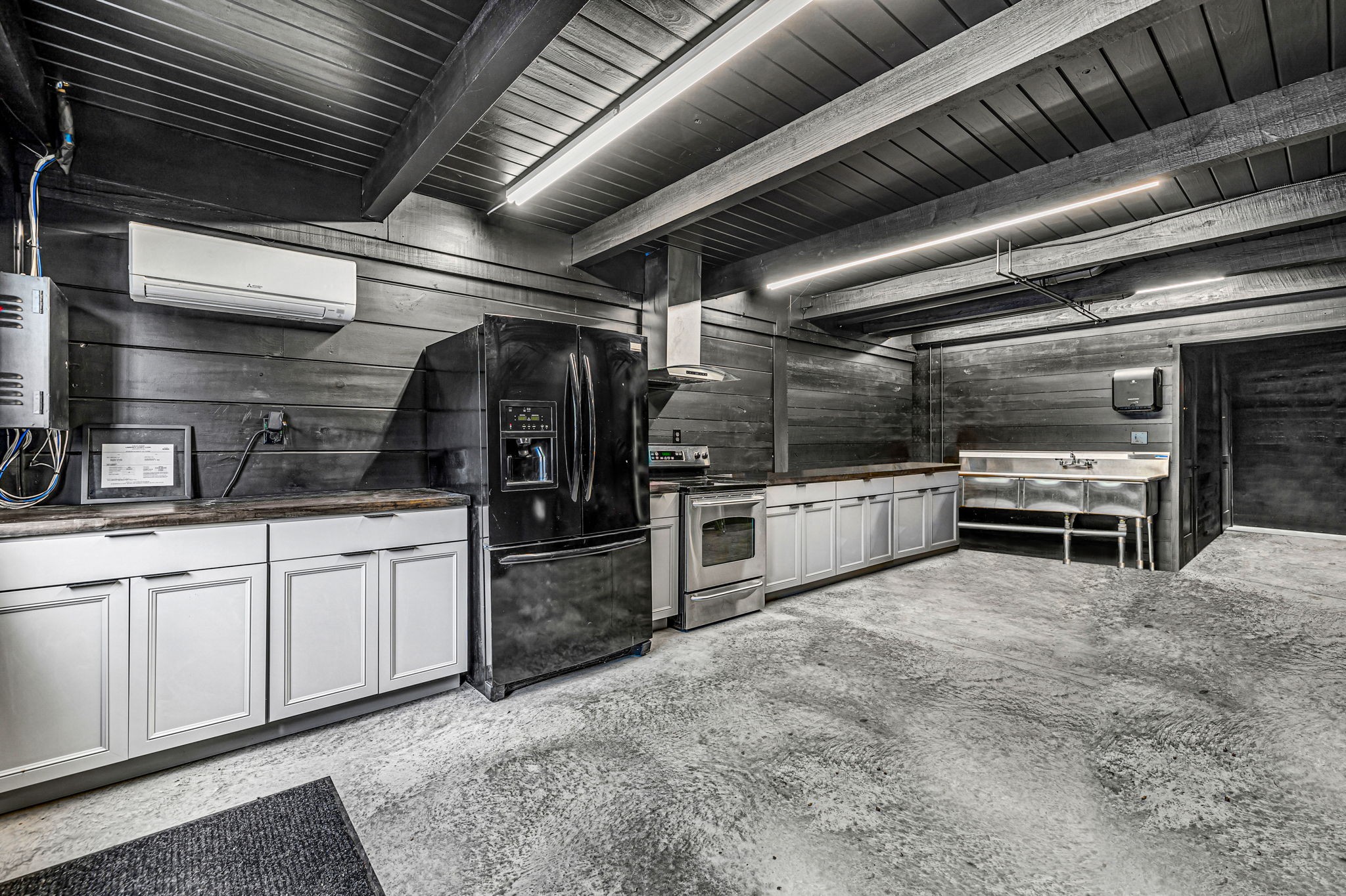232 Waterloo Road Lawrenceburg, TN 38464 - Photo 37 of 46 a kitchen with stainless steel appliances kitchen island granite countertop a sink counter top space and stainless steel appliances