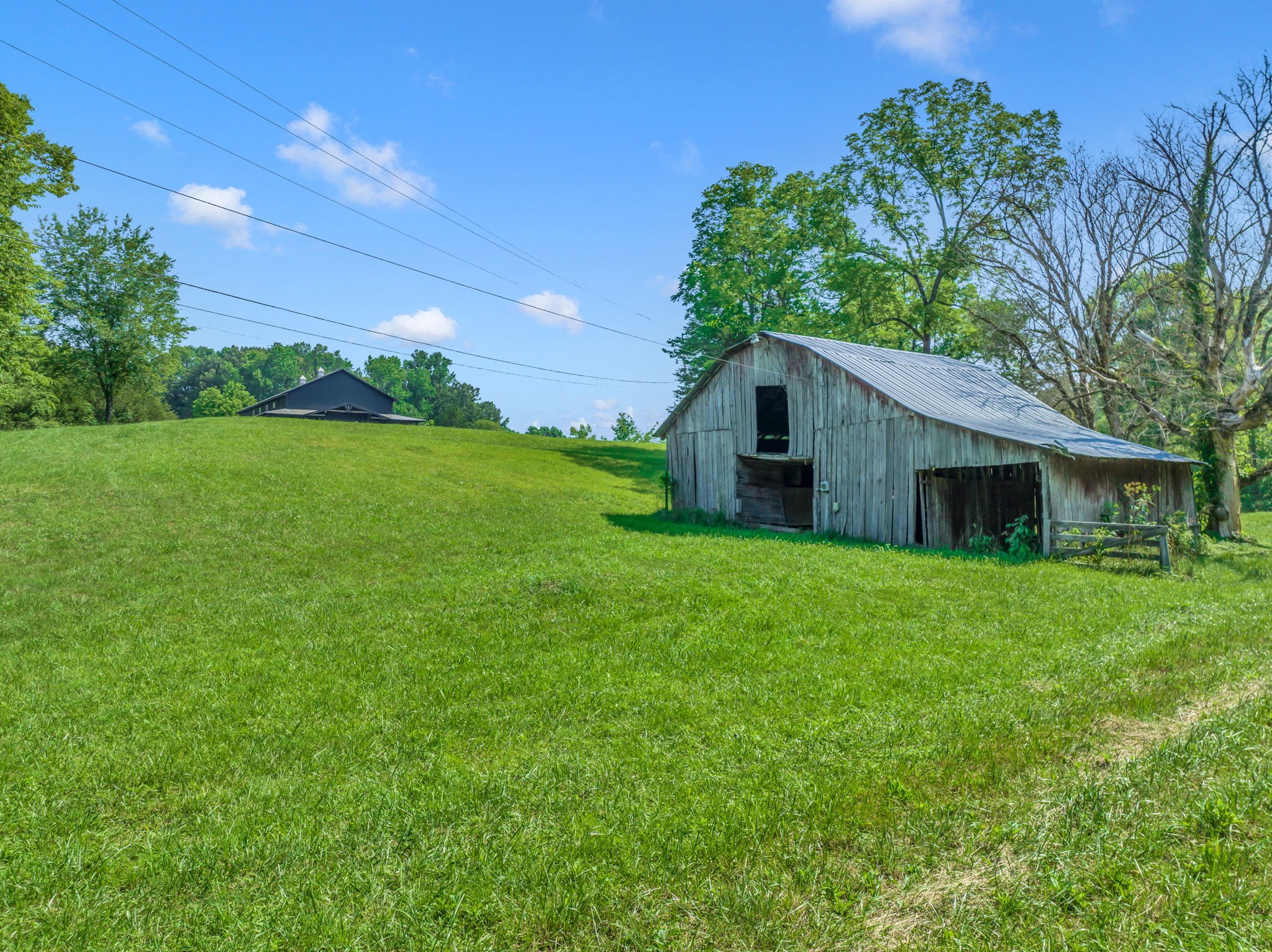 232 Waterloo Road Lawrenceburg, TN 38464 - Photo 41 of 46 a yellow and red house with a garden
