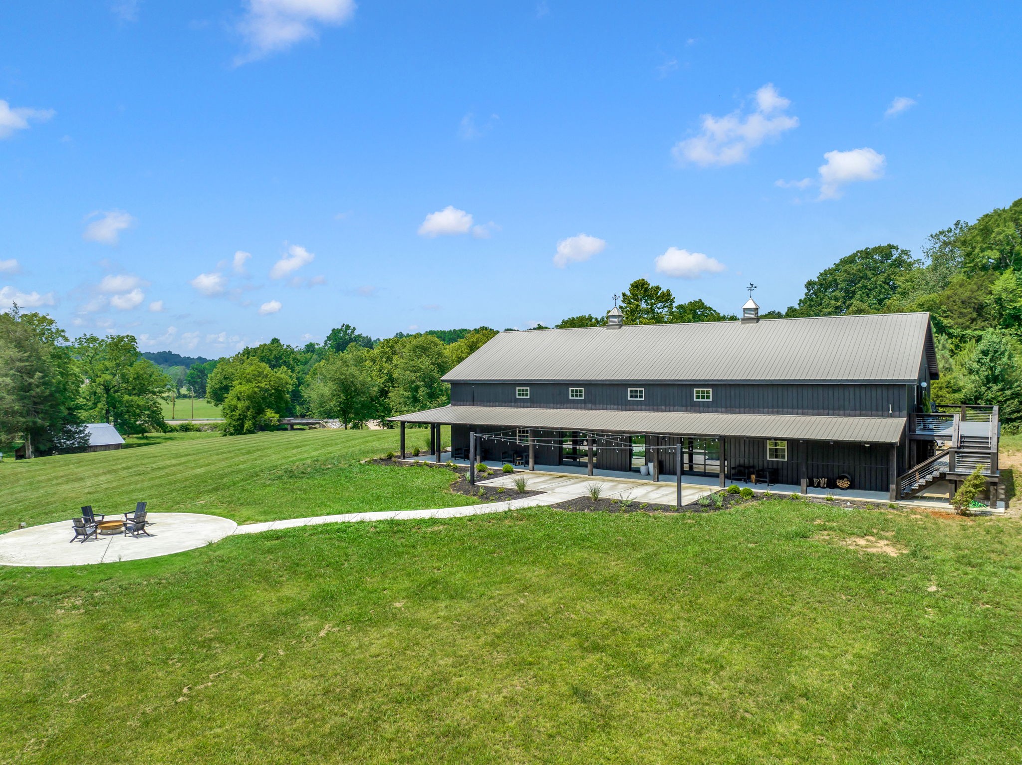 232 Waterloo Road Lawrenceburg, TN 38464 - Photo 43 of 46 a view of a house with a big yard and potted plants