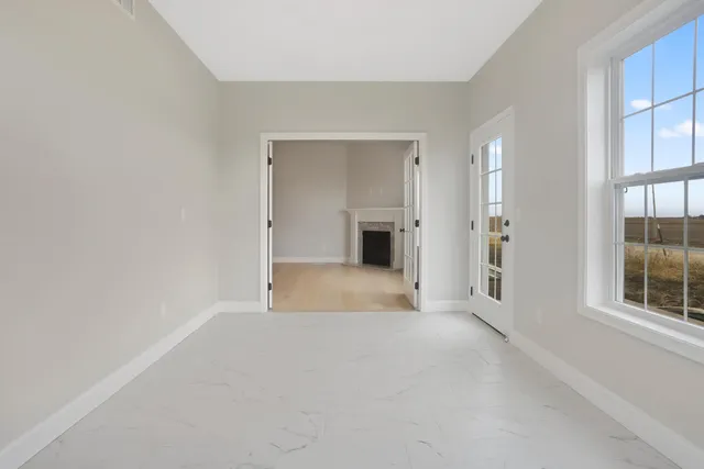 a view of an empty room with a window