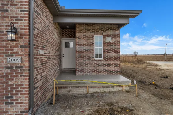 a brick house with a yard