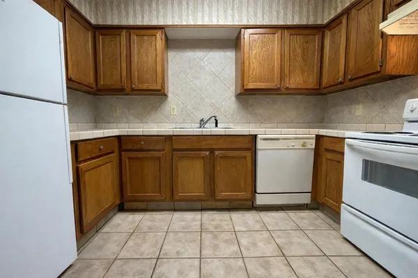 a kitchen with a sink and cabinets