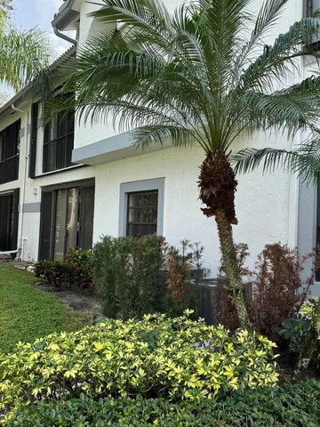 front view of a house with a garden