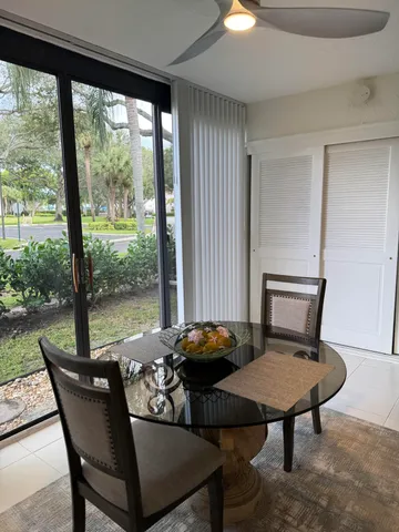 a bed room with a bed and a large window
