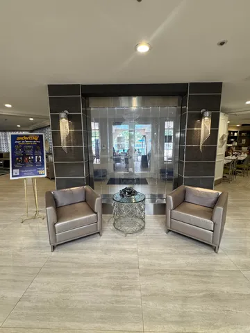 a lobby with furniture and window