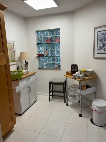 a kitchen with a sink cabinets and appliances
