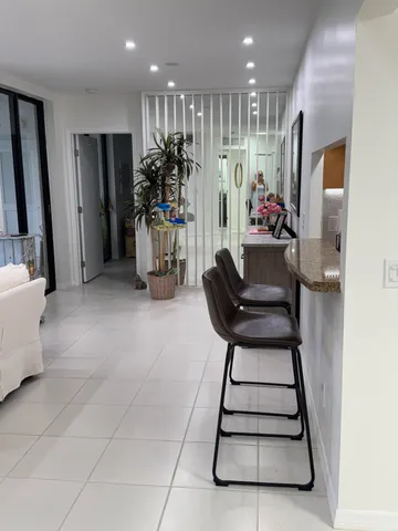 a room with furniture and a large window