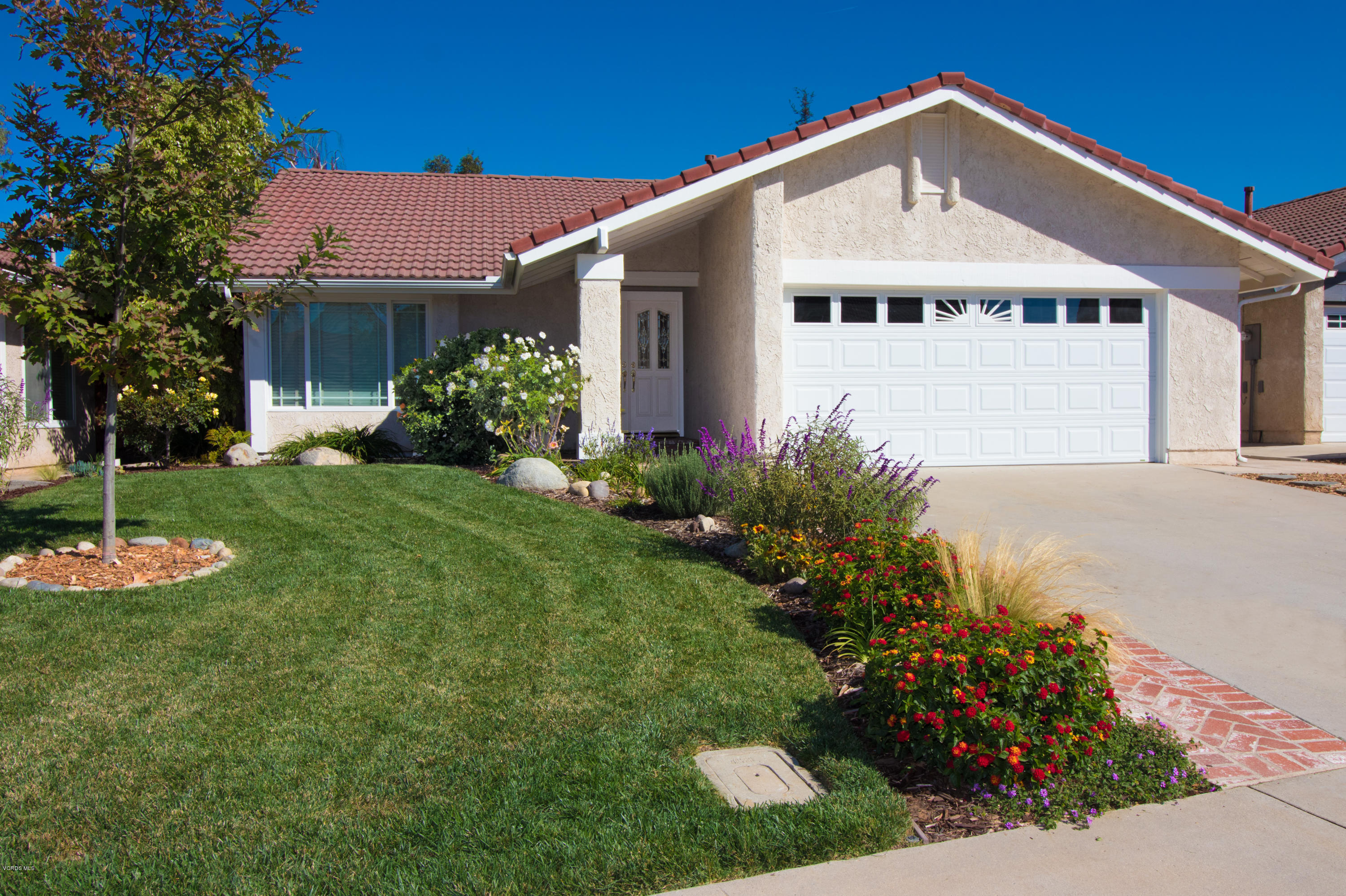 13671 Laurelhurst Road Moorpark, CA 93021 - Photo 1 of 32 a front view of a house with a yard