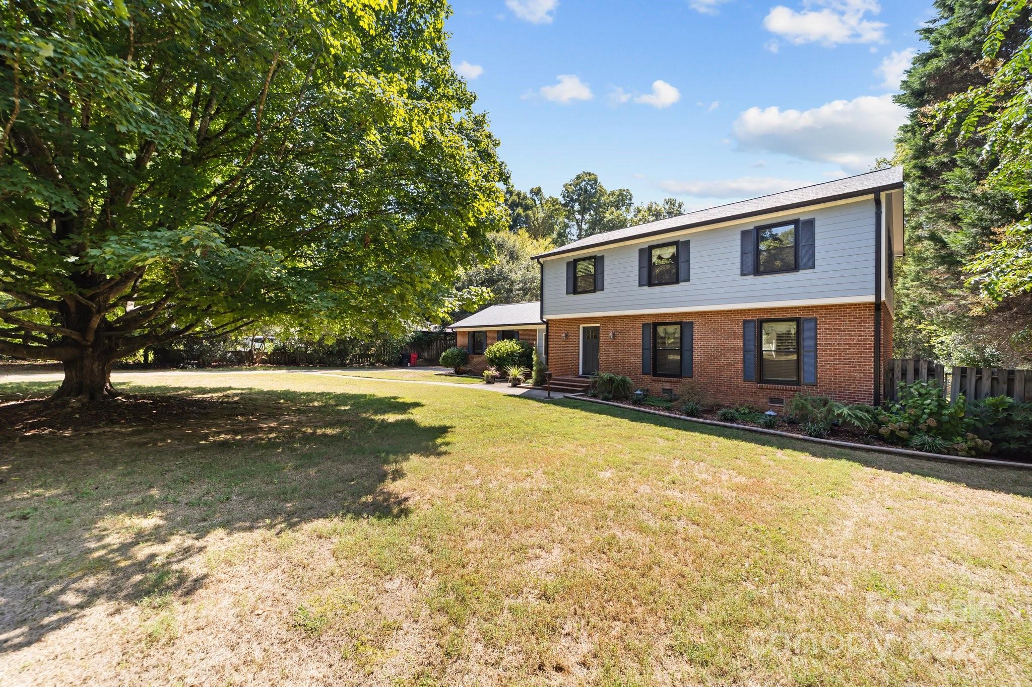 1060 Churchill Road Davidson, NC 28036 - Photo 1 of 41 a front view of a house with a yard