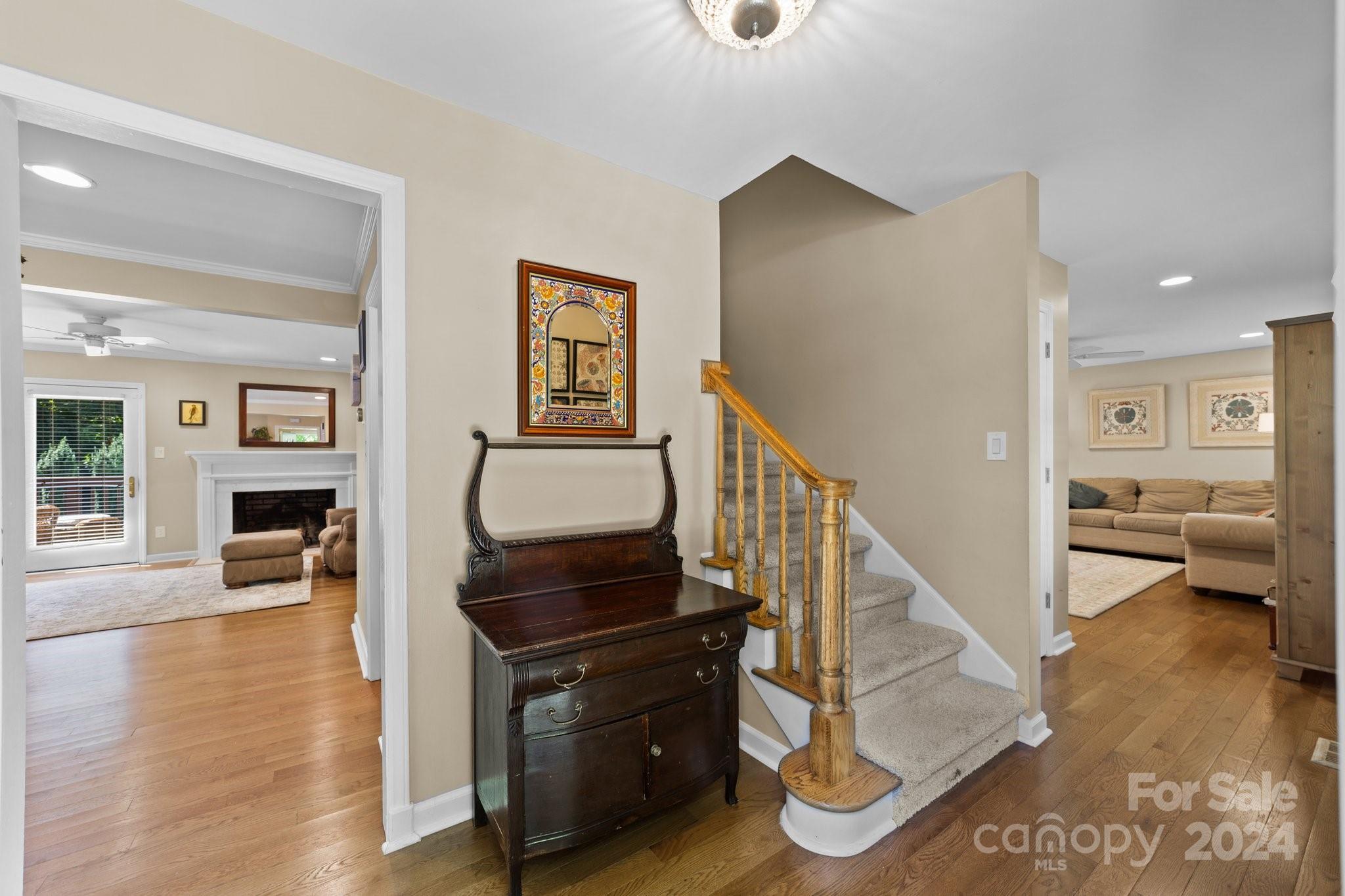 1060 Churchill Road Davidson, NC 28036 - Photo 14 of 41 a living room with furniture and a wooden floor