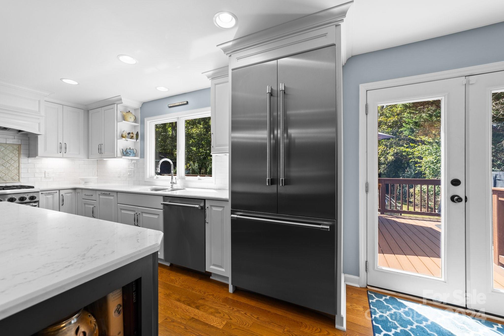 1060 Churchill Road Davidson, NC 28036 - Photo 24 of 41 a kitchen with a refrigerator and countertop