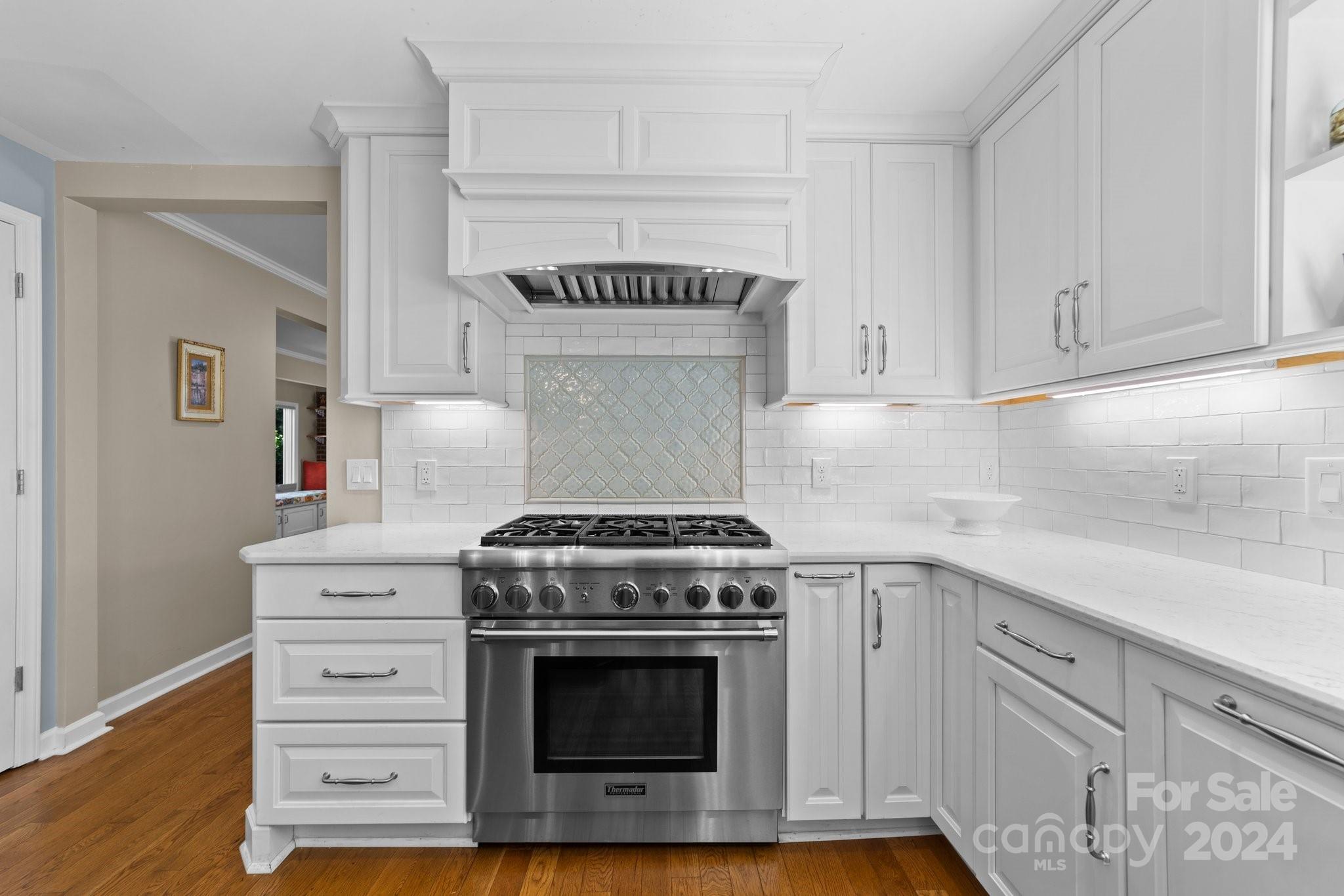1060 Churchill Road Davidson, NC 28036 - Photo 26 of 41 a stove top oven sitting inside of a kitchen
