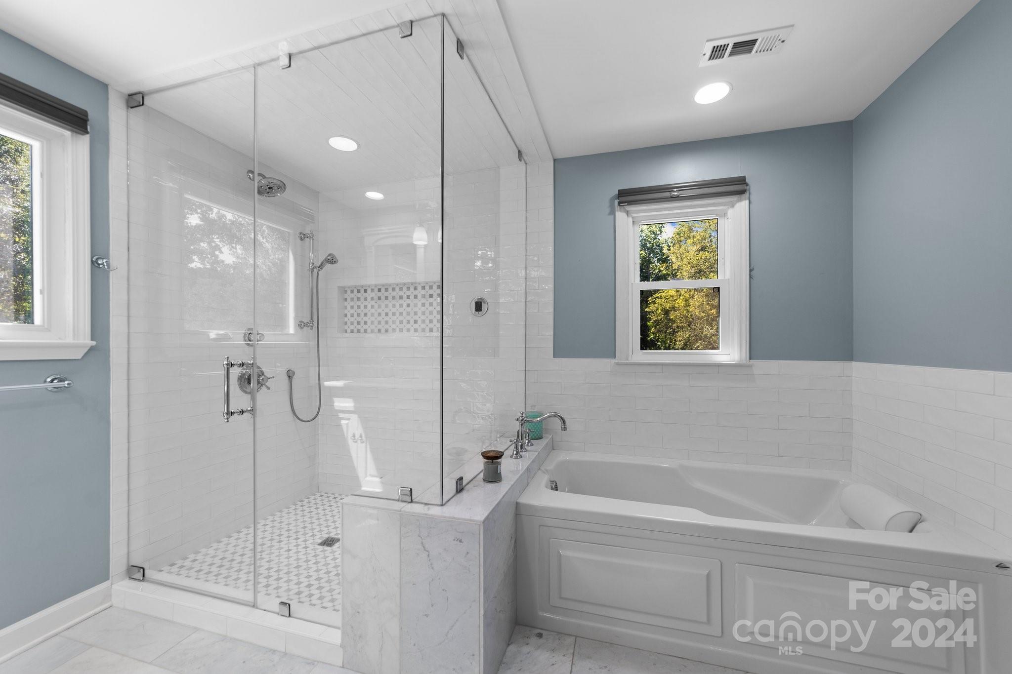 1060 Churchill Road Davidson, NC 28036 - Photo 30 of 41 a bathroom with a bathtub and a shower