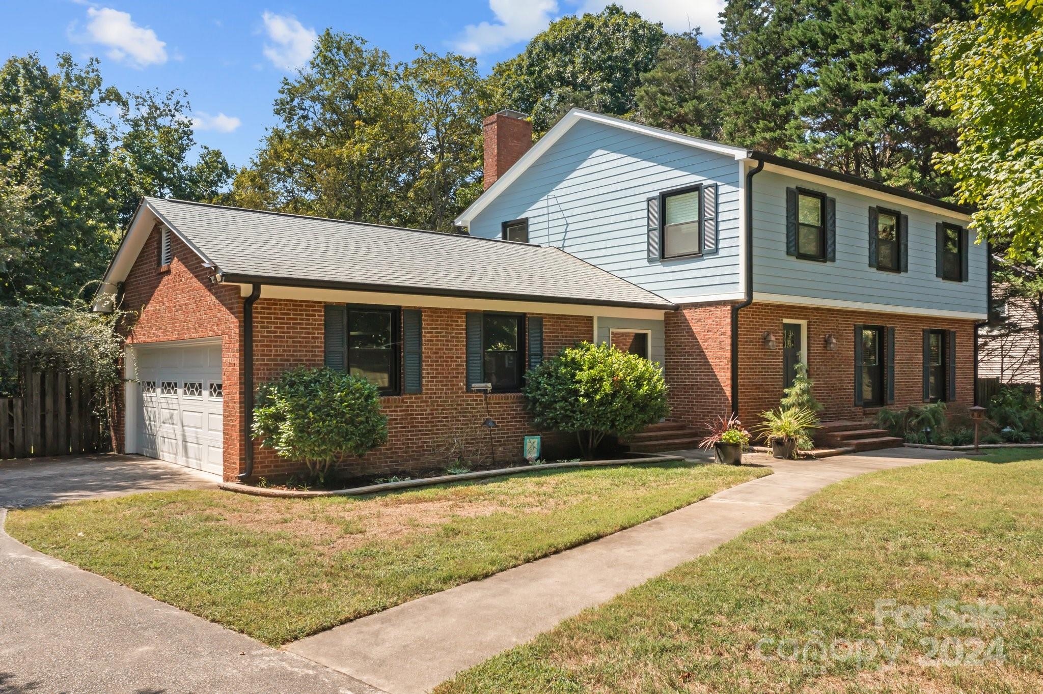 1060 Churchill Road Davidson, NC 28036 - Photo 3 of 41 a front view of a house with a yard