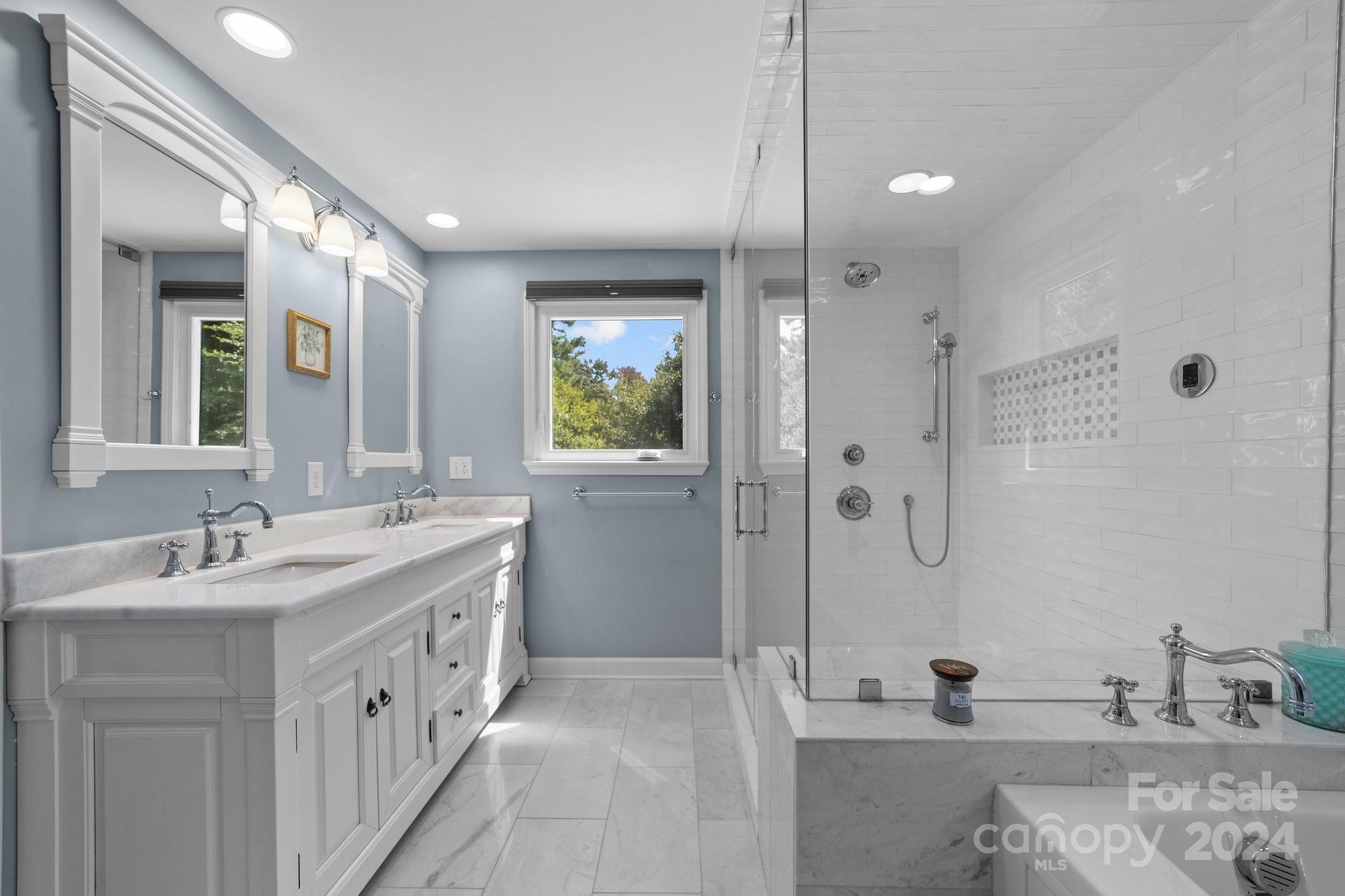 1060 Churchill Road Davidson, NC 28036 - Photo 31 of 41 a bathroom with a double vanity sink mirror and shower