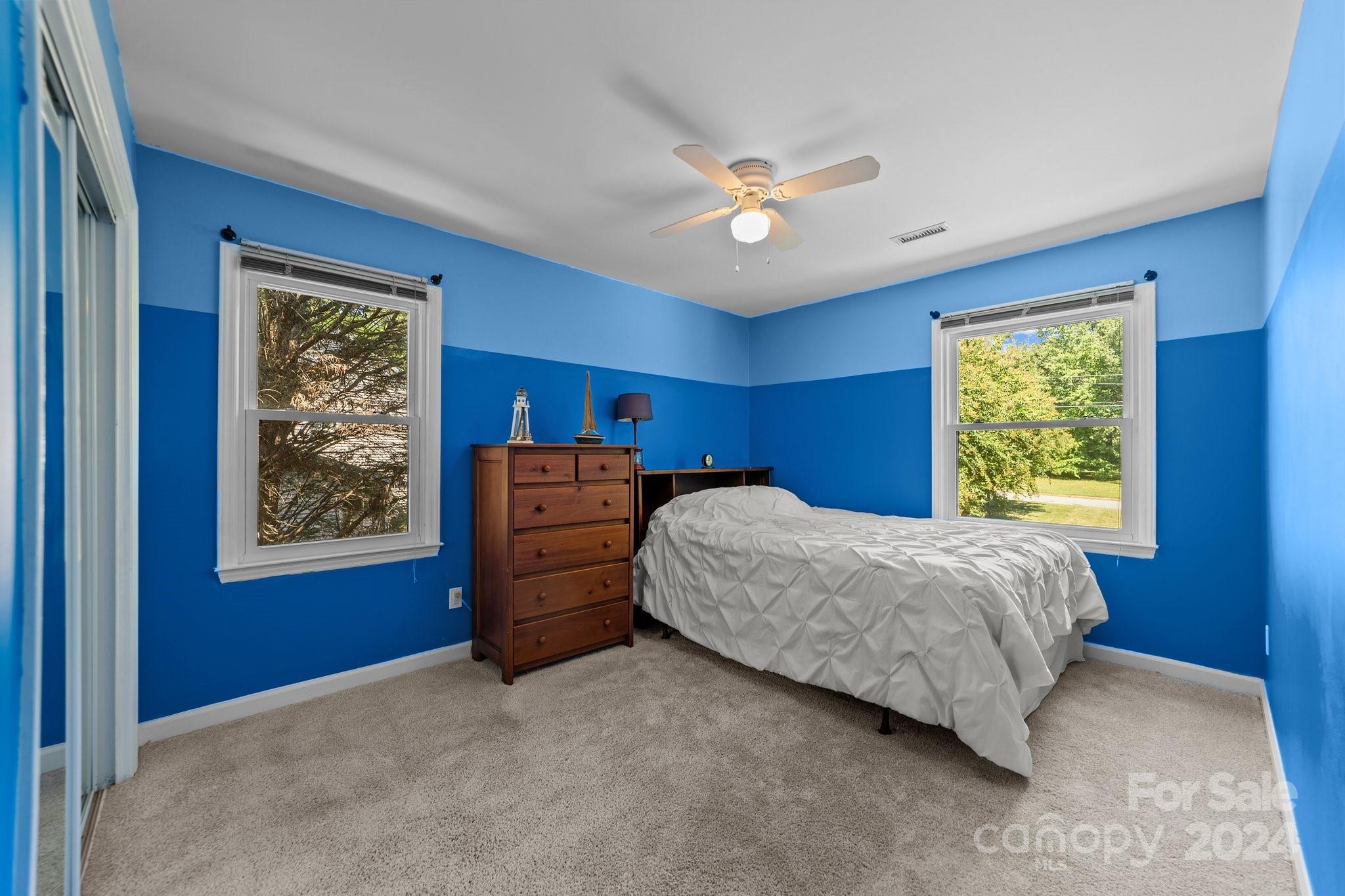 1060 Churchill Road Davidson, NC 28036 - Photo 34 of 41 a bedroom with a bed and a window