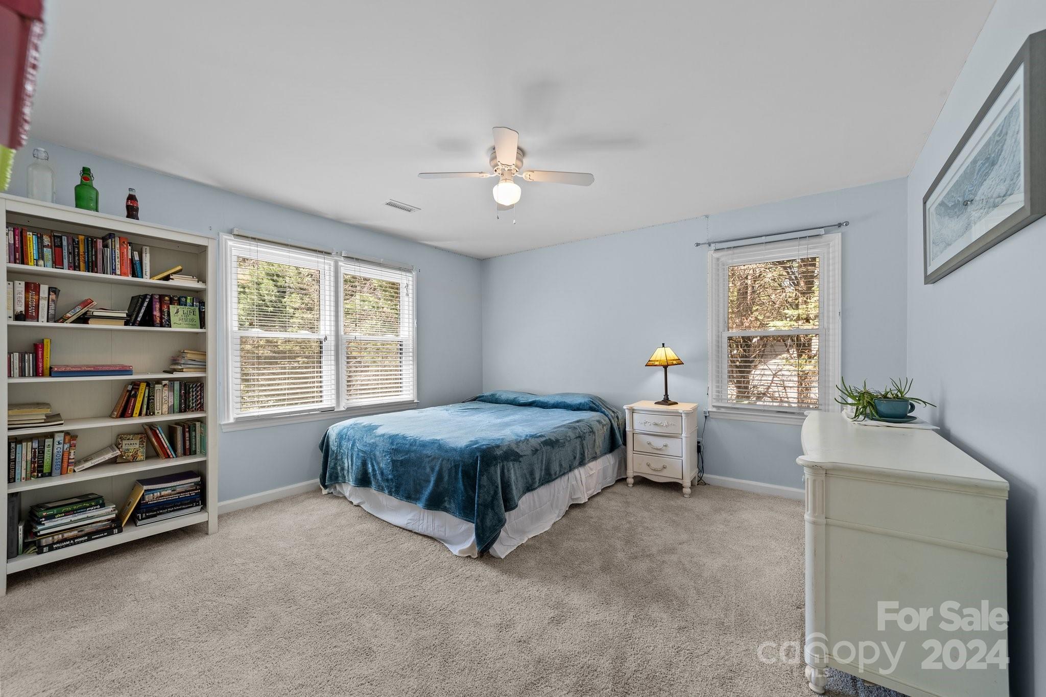 1060 Churchill Road Davidson, NC 28036 - Photo 35 of 41 a bed room with a bed and a book shelf
