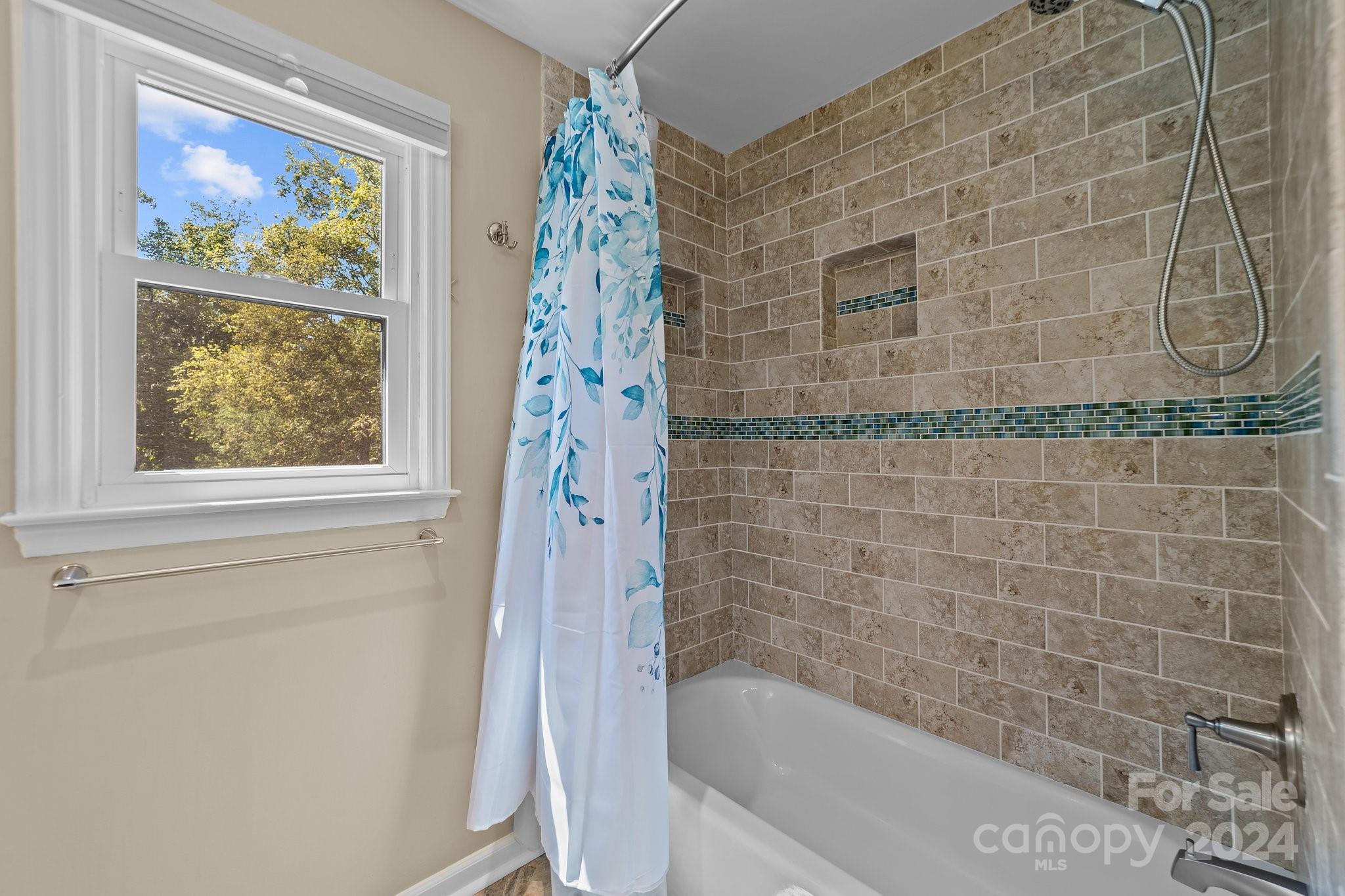 1060 Churchill Road Davidson, NC 28036 - Photo 37 of 41 a bathroom with a bathtub and shower