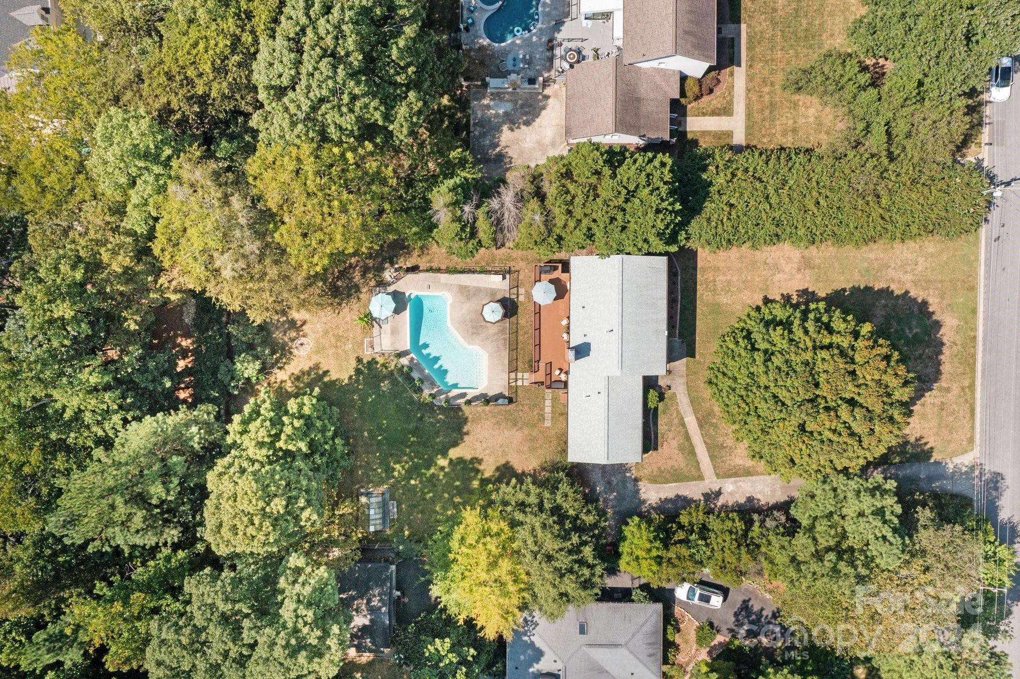 1060 Churchill Road Davidson, NC 28036 - Photo 38 of 41 an aerial view of a house with a yard and garden