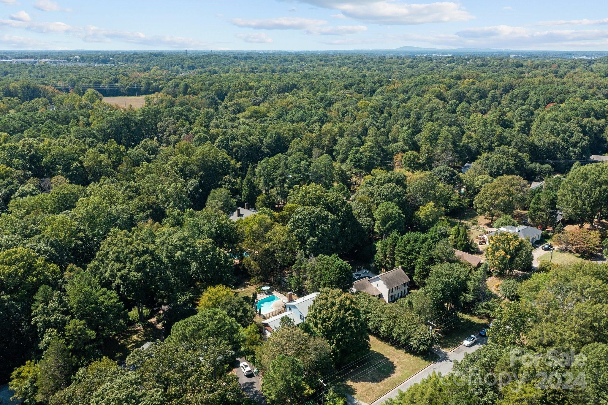 1060 Churchill Road Davidson, NC 28036 - Photo 41 of 41 an aerial view of a house with a yard