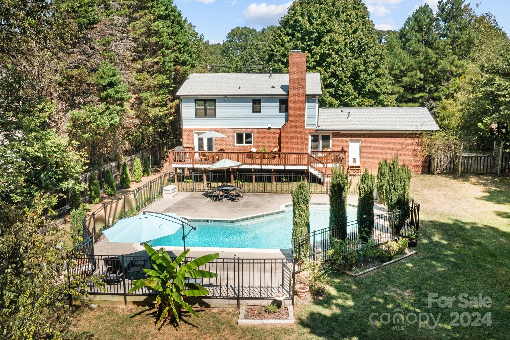 1060 Churchill Road Davidson, NC 28036 - Photo 5 of 41 an aerial view of a house with outdoor seating