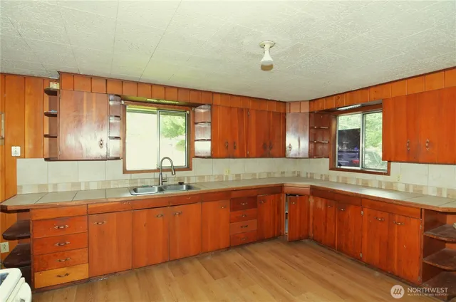 a kitchen with sink and window