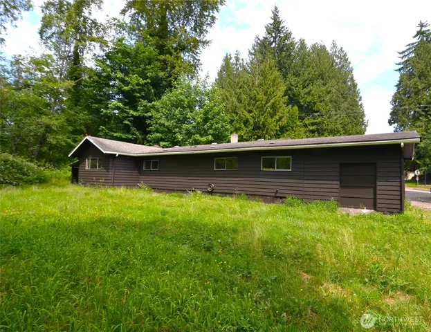 a backyard of a house with lots of green space