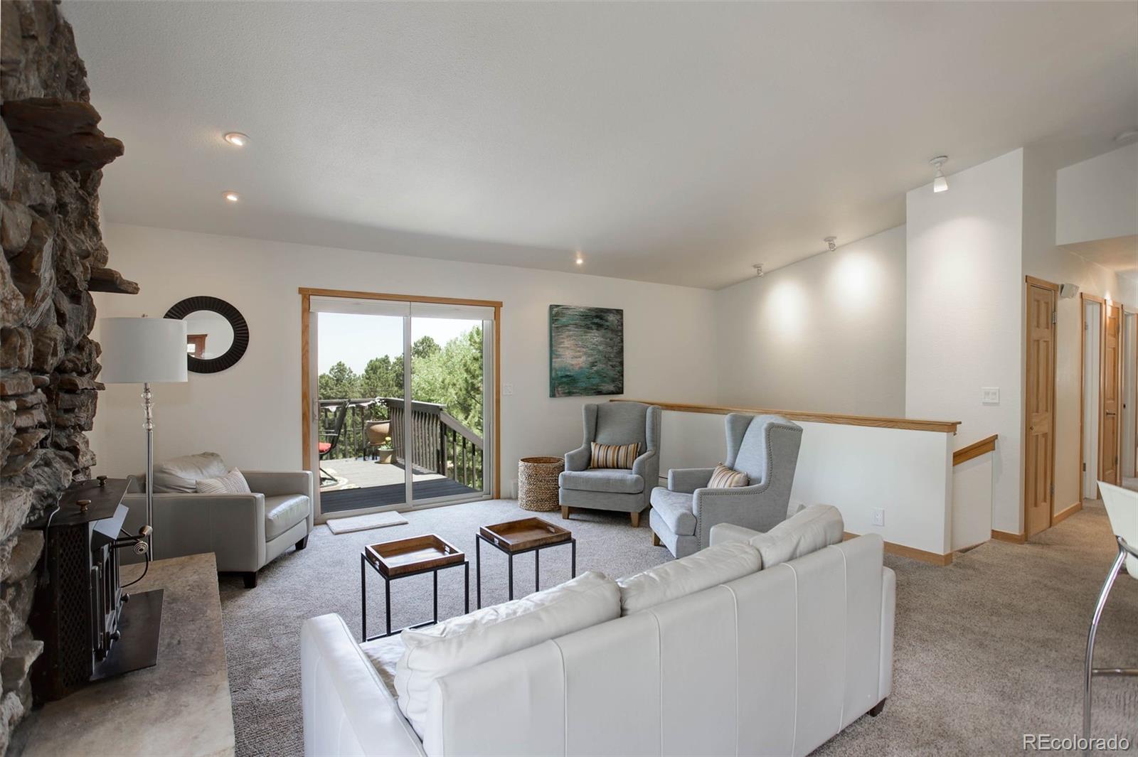 586 Brook Road Boulder, CO 80302 - Photo 13 of 37 a living room with furniture and a large window