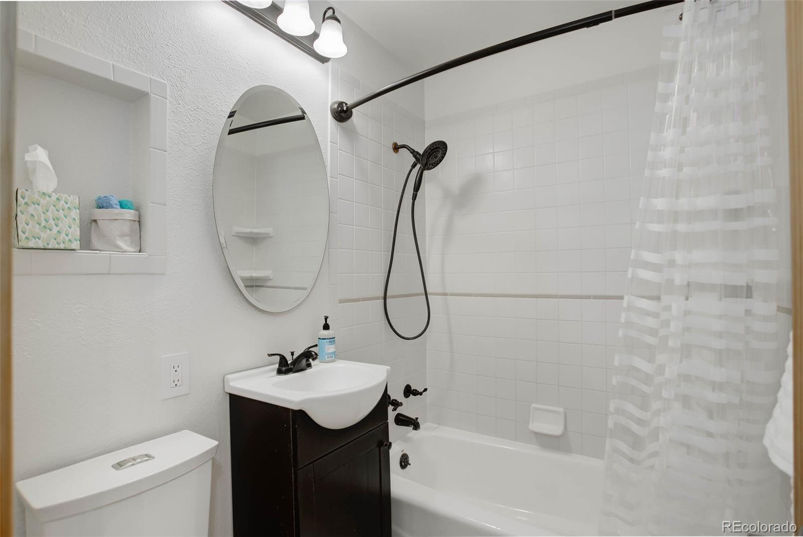 586 Brook Road Boulder, CO 80302 - Photo 22 of 37 a bathroom with a sink vanity mirror and toilet
